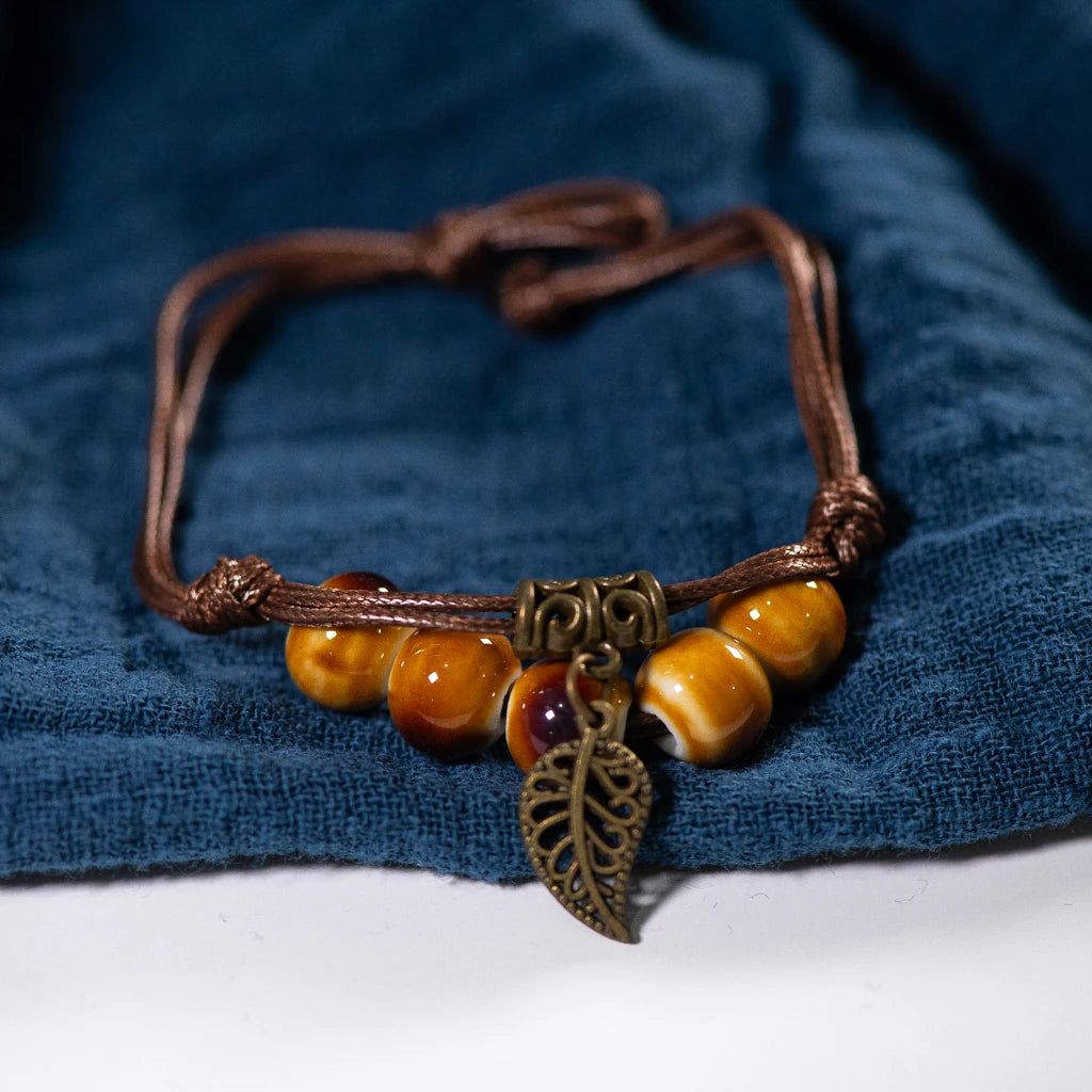 Brown bead bracelet with Brown Strand and metal leaf