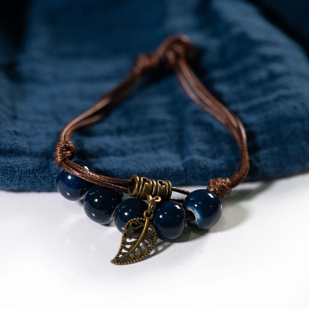 Dark Blue Bead Bracelet with metal leaf