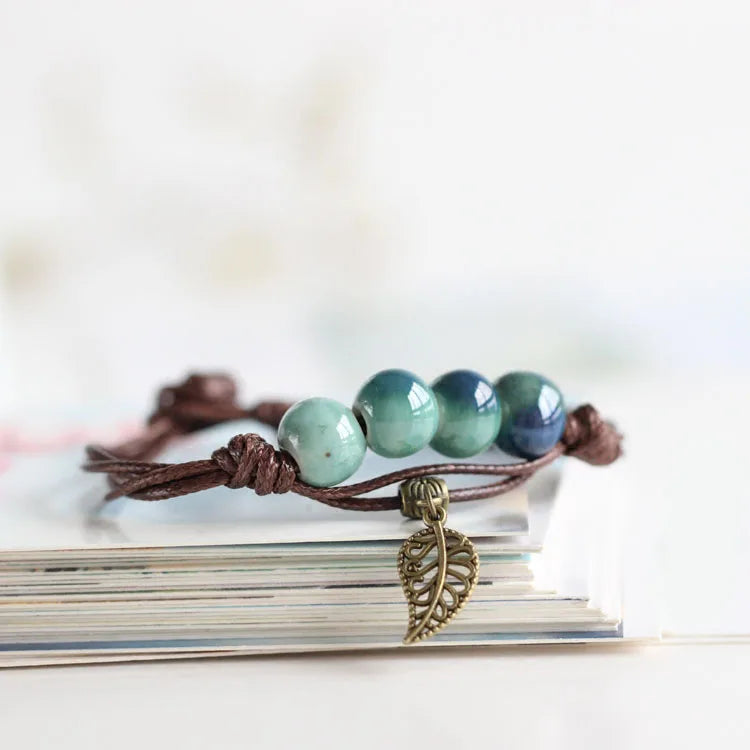 Women's ceramic bead bracelet with vintage copper charm and easy-hook with blue beads